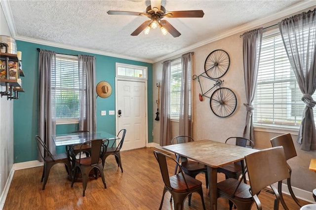 3115 Conti St, New Orleans, LA 70119 - dining room with light wood finished floors, a textured ceiling, healthy amount of natural light, a ceiling fan, and baseboards