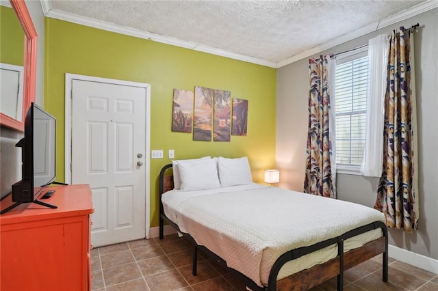 3115 Conti St, New Orleans, LA 70119 - bedroom with ornamental molding, a textured ceiling, light tile patterned flooring, and baseboards