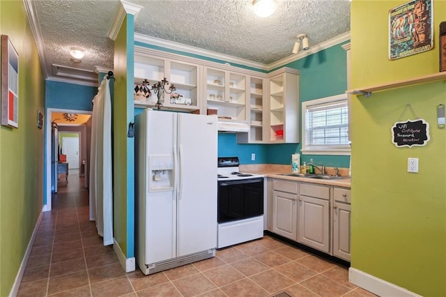 3115 Conti St, New Orleans, LA 70119 - kitchen featuring white appliances, a sink, crown molding, a textured ceiling, and light tile patterned floors
