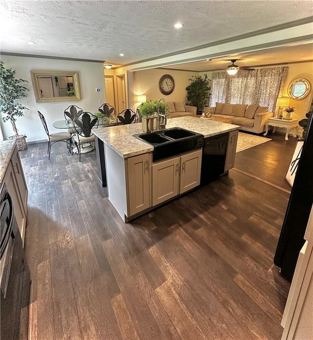 40140 Fire Tower Rd, Ponchatoula, LA 70454 - kitchen featuring a sink, a textured ceiling, dark wood-style floors, a kitchen island with sink, and open floor plan