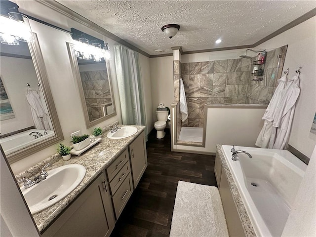 40140 Fire Tower Rd, Ponchatoula, LA 70454 - full bath featuring a textured ceiling, wood finished floors, a tub, a tile shower, and ornamental molding