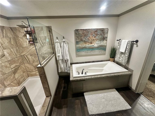 40140 Fire Tower Rd, Ponchatoula, LA 70454 - bathroom featuring a garden tub, wood finished floors, and walk in shower