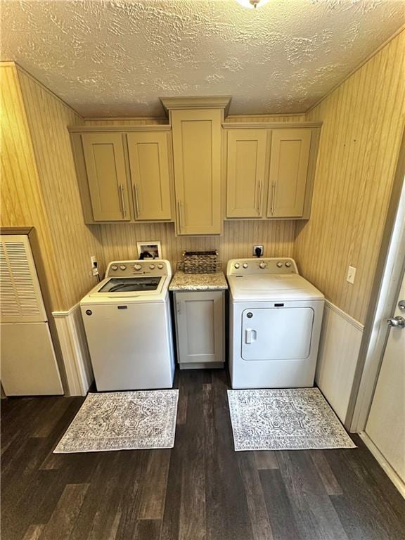 40140 Fire Tower Rd, Ponchatoula, LA 70454 - laundry room with cabinet space, dark wood finished floors, a textured ceiling, wooden walls, and washer hookup