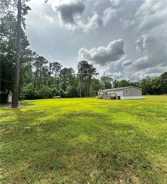 40140 Fire Tower Rd, Ponchatoula, LA 70454 - view of green lawn with a deck