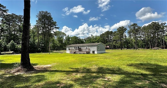 40140 Fire Tower Rd, Ponchatoula, LA 70454 - view of green lawn with a deck