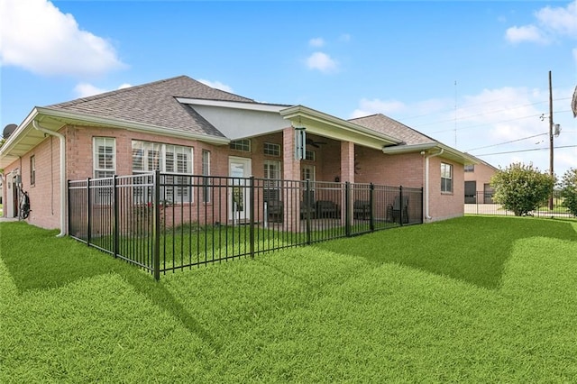 101 Portrush Dr, La Place, LA 70068 - back of property with brick siding, a shingled roof, and ceiling fan