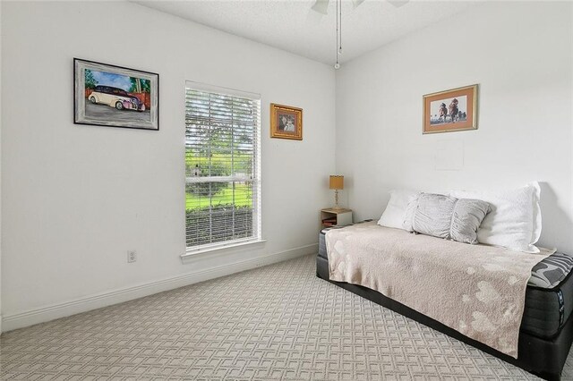 101 Portrush Dr, La Place, LA 70068 - carpeted bedroom featuring baseboards and a ceiling fan