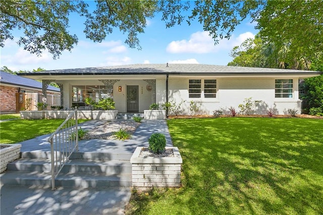 7449 Cameo St, New Orleans, LA 70124 - ranch-style house with brick siding, covered porch, and a front yard