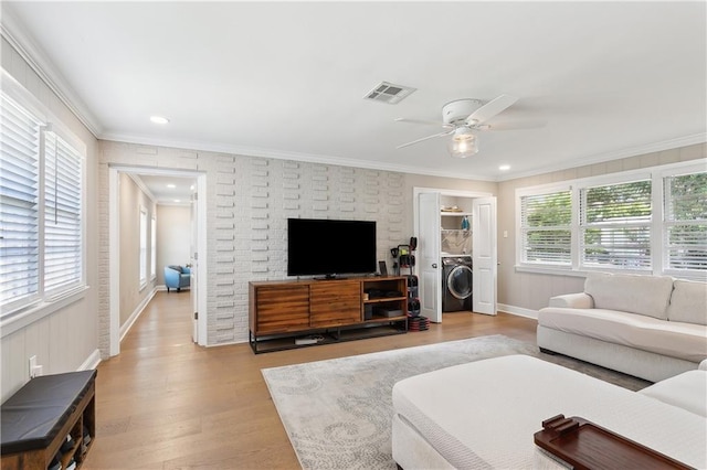 7449 Cameo St, New Orleans, LA 70124 - living room featuring washer / dryer, light wood-type flooring, a ceiling fan, crown molding, and recessed lighting