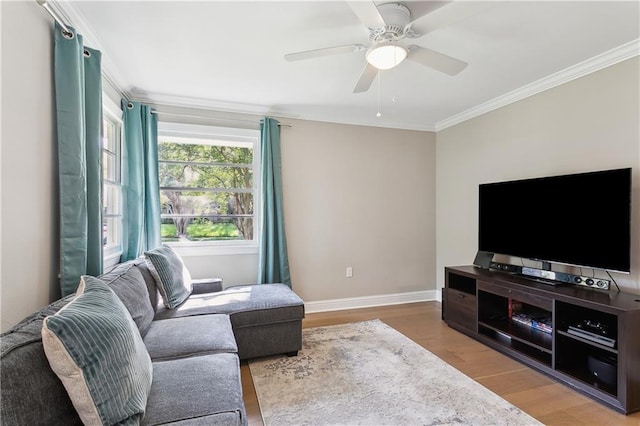 7449 Cameo St, New Orleans, LA 70124 - living area featuring crown molding, wood finished floors, baseboards, and ceiling fan
