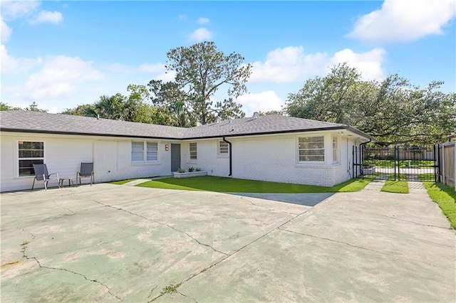 7449 Cameo St, New Orleans, LA 70124 - back of house with brick siding and a patio area