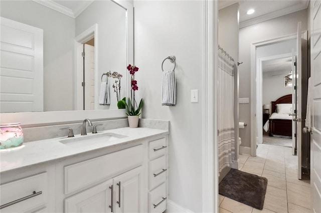 2040 Cypress Bend Ln, Madisonville, LA 70447 - ensuite bathroom featuring ornamental molding, vanity, tile patterned floors, and baseboards