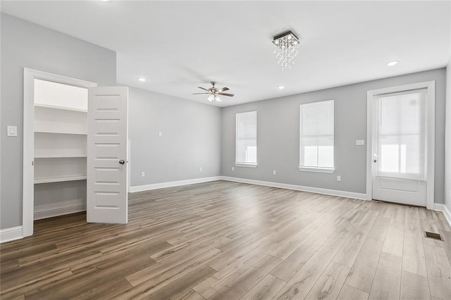 2830-32 Spain St, New Orleans, LA 70122 - unfurnished living room featuring wood finished floors, ceiling fan, and recessed lighting