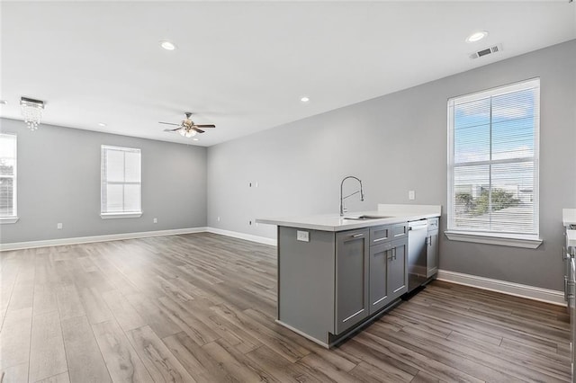 2830-32 Spain St, New Orleans, LA 70122 - kitchen featuring gray cabinetry, stainless steel dishwasher, a ceiling fan, dark wood-style floors, and recessed lighting