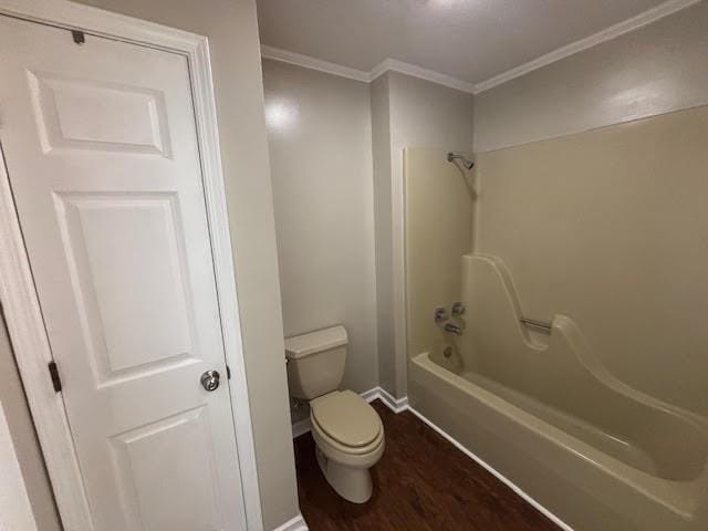 138 Woodland Ridge Dr, Mccomb, MS 39648 - full bathroom featuring crown molding, baseboards, wood finished floors, toilet, and shower / tub combination