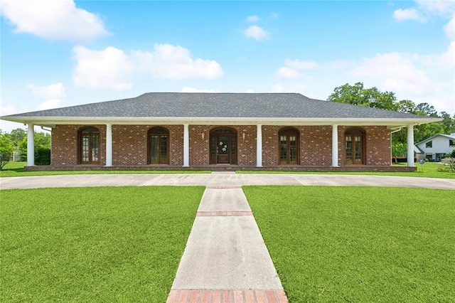 221 Woodbridge Blvd, Hammond, LA 70401 - single story home with a front lawn, french doors, a porch, and brick siding