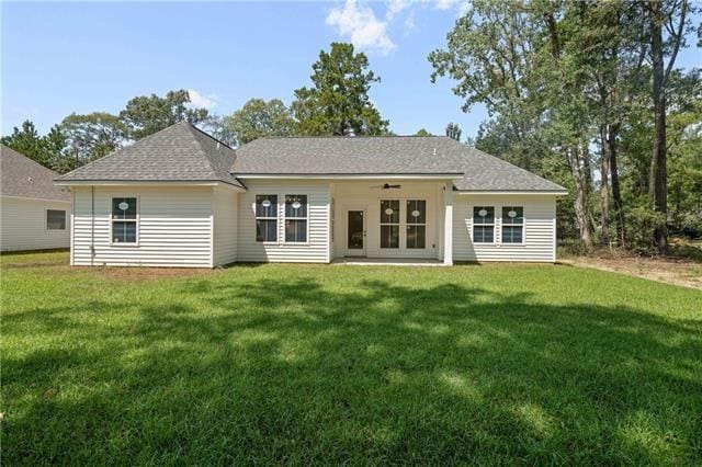 14321 Lake Tahoe Dr, Covington, LA 70433 - back of property featuring a yard, ceiling fan, roof with shingles, and french doors