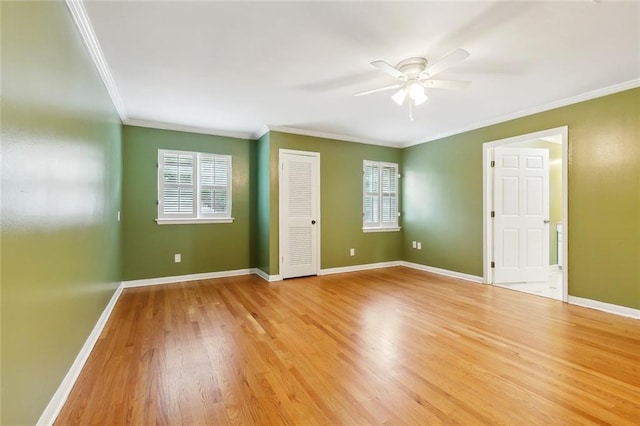 3501 Pin Oak Ave, New Orleans, LA 70131 - spare room with ornamental molding, a ceiling fan, light wood-type flooring, and baseboards