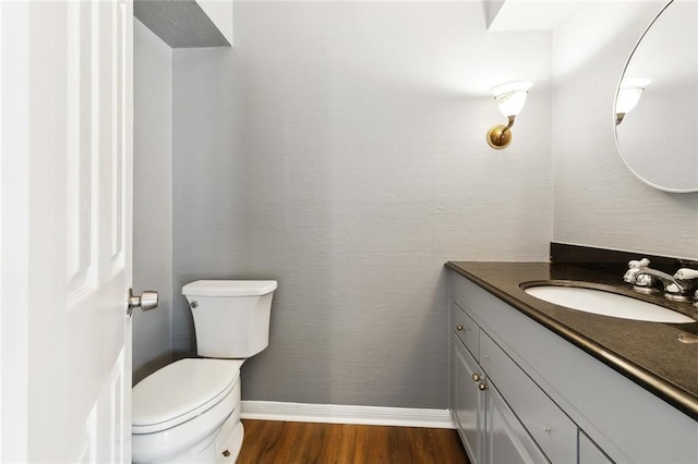 3501 Pin Oak Ave, New Orleans, LA 70131 - half bath with vanity, wood finished floors, and toilet