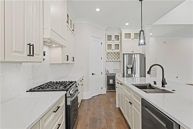 2104 Mississippi Ave, Metairie, LA 70003 - kitchen featuring appliances with stainless steel finishes, a sink, dark wood finished floors, decorative light fixtures, and recessed lighting