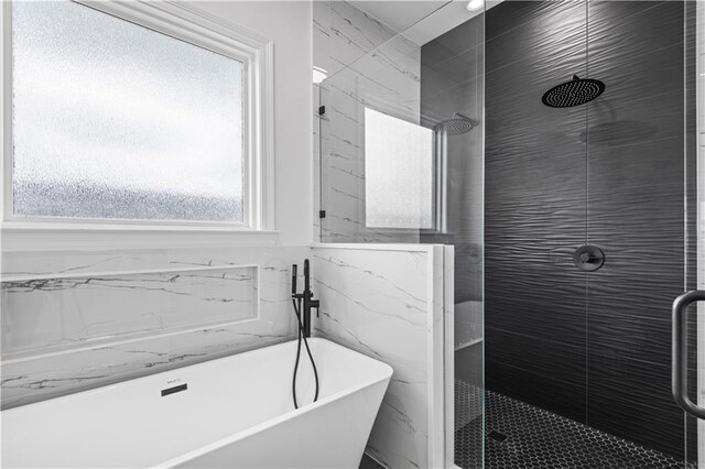 2104 Mississippi Ave, Metairie, LA 70003 - bathroom with a stall shower, a soaking tub, and tile walls