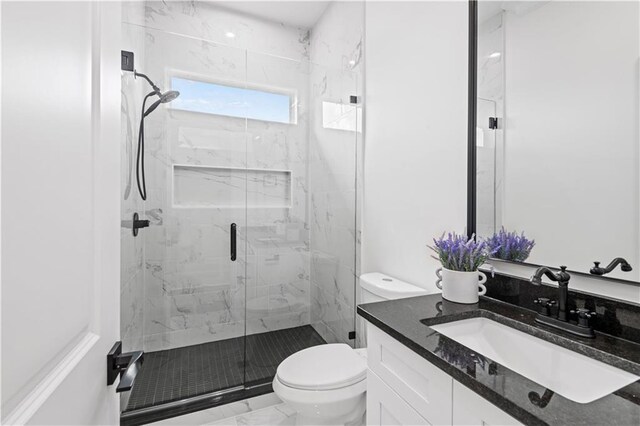 2104 Mississippi Ave, Metairie, LA 70003 - full bathroom featuring toilet, a marble finish shower, marble finish floors, and vanity