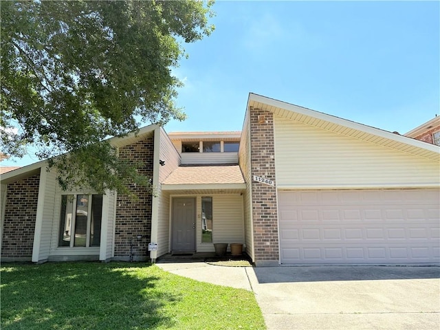 11240 Winrock Dr, New Orleans, LA 70128 - mid-century modern home with concrete driveway, brick siding, an attached garage, and a front yard