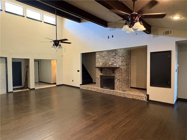11240 Winrock Dr, New Orleans, LA 70128 - unfurnished living room with ceiling fan, high vaulted ceiling, baseboards, wood finished floors, and a brick fireplace