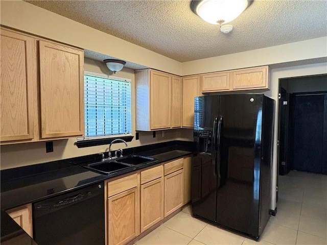 11240 Winrock Dr, New Orleans, LA 70128 - kitchen featuring black appliances, light brown cabinetry, a sink, light tile patterned floors, and dark countertops