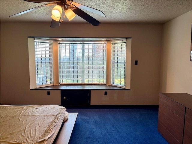 11240 Winrock Dr, New Orleans, LA 70128 - carpeted bedroom featuring a textured ceiling, ceiling fan, and baseboards