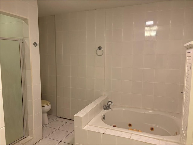 11240 Winrock Dr, New Orleans, LA 70128 - bathroom featuring a stall shower, a tub with jets, toilet, tile patterned floors, and tile walls