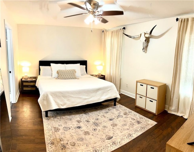 40081 Bismark St, Ponchatoula, LA 70454 - bedroom featuring dark wood-type flooring, baseboards, and a ceiling fan
