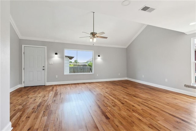 unfurnished living room with crown molding, light wood-style flooring, a ceiling fan, lofted ceiling, and baseboards