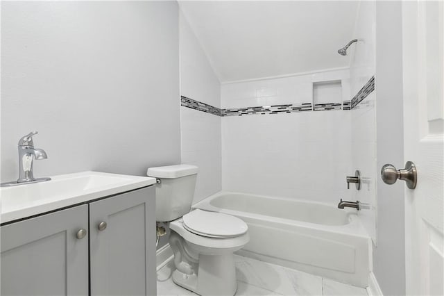 full bathroom with baseboards, toilet, shower / washtub combination, vanity, and marble look tiles