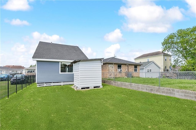 back of house with an outbuilding