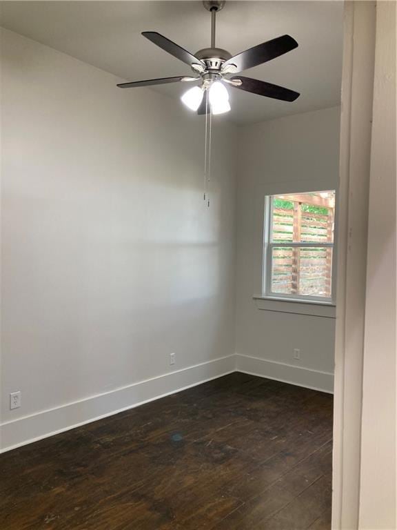 3515 S Miro St, New Orleans, LA 70125 - empty room with baseboards, dark wood-type flooring, and ceiling fan