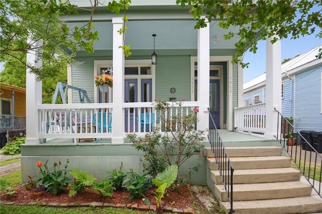 rear view of house with a porch
