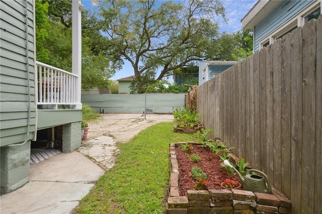 fenced backyard with a patio area