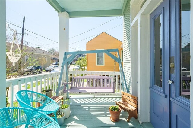 balcony featuring a porch