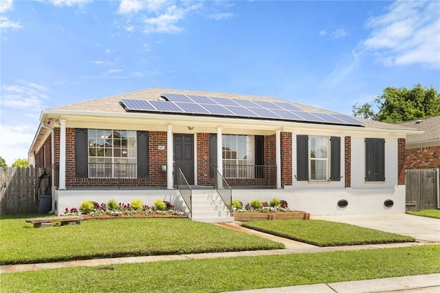 5801 Ruth St, Metairie, LA 70003 - single story home with a porch, solar panels, and brick siding