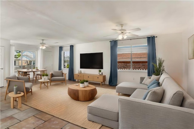 5801 Ruth St, Metairie, LA 70003 - living room featuring ceiling fan and light tile patterned floors