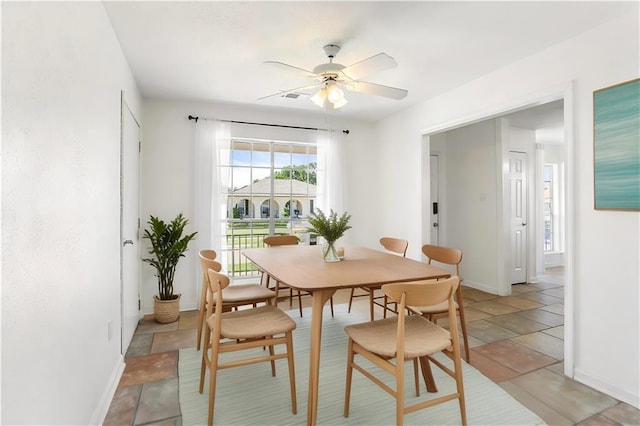 5801 Ruth St, Metairie, LA 70003 - dining area featuring a ceiling fan and baseboards