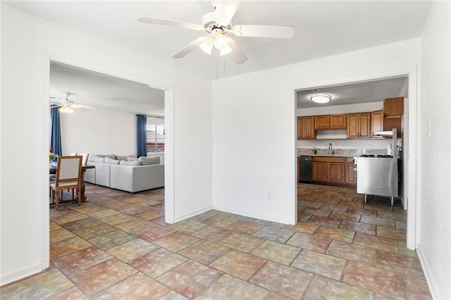 5801 Ruth St, Metairie, LA 70003 - kitchen featuring dishwasher, ceiling fan, brown cabinetry, and light stone finish floors