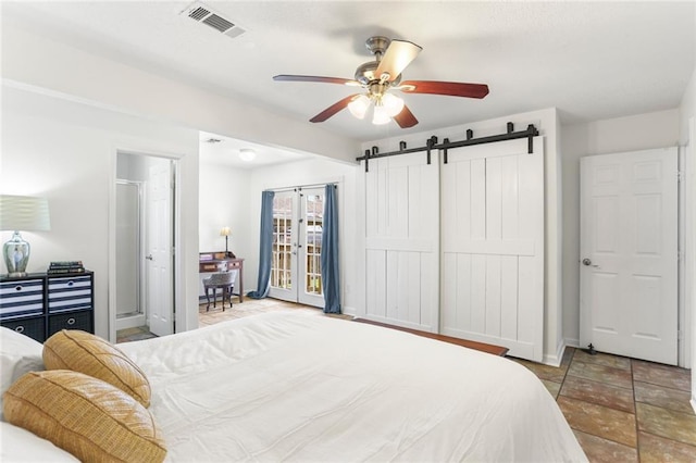 5801 Ruth St, Metairie, LA 70003 - bedroom featuring a barn door and a ceiling fan