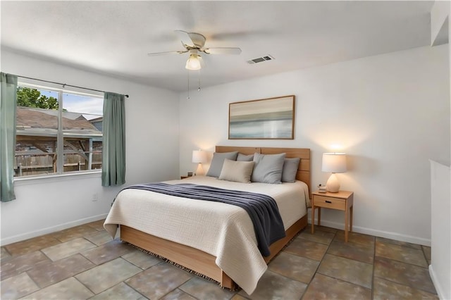 5801 Ruth St, Metairie, LA 70003 - bedroom featuring baseboards and a ceiling fan