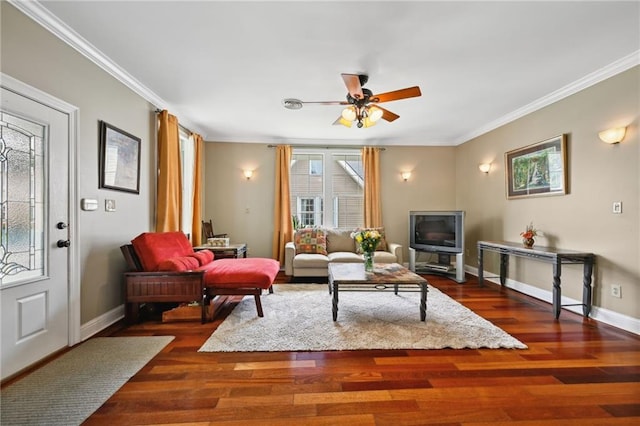 living room with ornamental molding, ceiling fan, baseboards, and dark wood-style floors