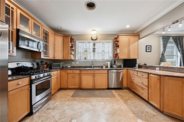 kitchen featuring appliances with stainless steel finishes, open shelves, crown molding, a sink, and a peninsula