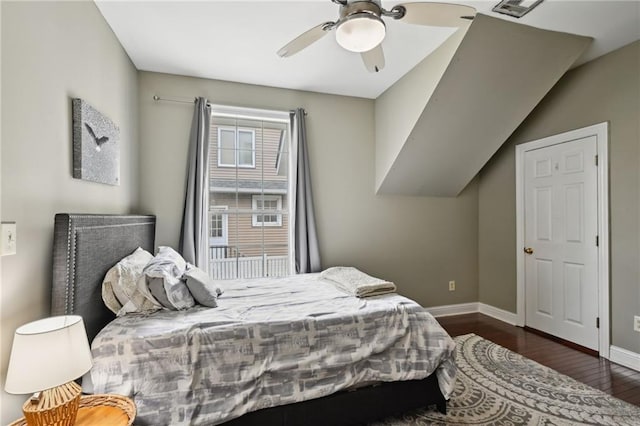 bedroom with wood finished floors, baseboards, and a ceiling fan