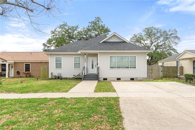 1412 Clay St, Kenner, LA 70062 - view of front facade with crawl space, a shingled roof, and concrete driveway