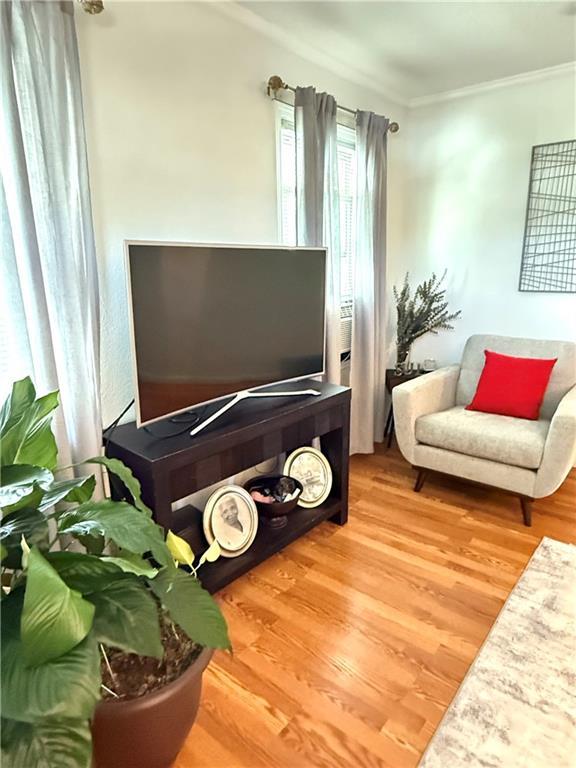 4560 Laine Ave, New Orleans, LA 70126 - sitting room with ornamental molding and wood finished floors